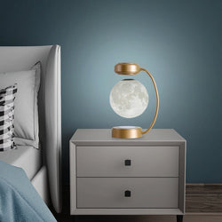 Image of 3D LED Moon Night Light Wireless Magnetic Levitating Rotatin on a bedside table in a modern bedroom setting.